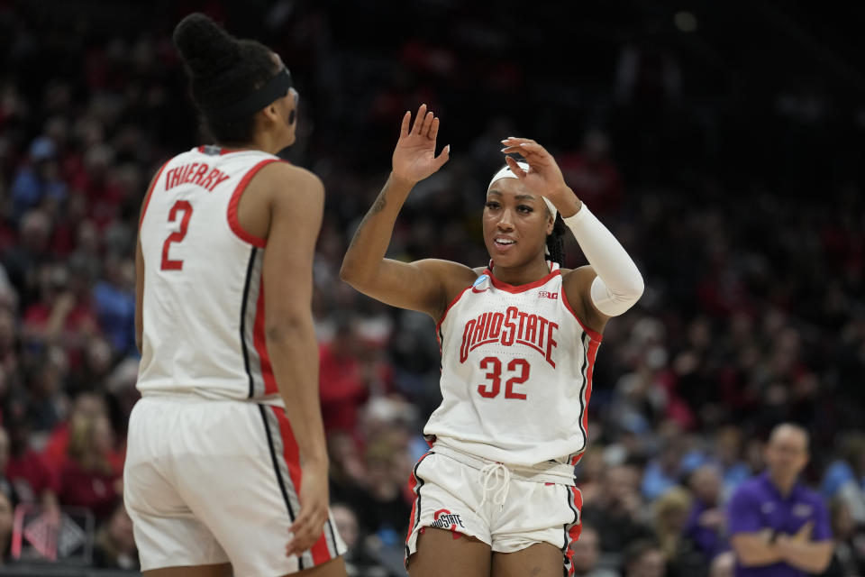 Ohio State forward Cotie McMahon (32) celebrates with Taylor Thierry in the second half of a first-round college basketball game against James Madison in the women's NCAA Tournament in Columbus, Ohio, Saturday, March 18, 2023. Ohio State defeated James Madison 80-66. (AP Photo/Michael Conroy)