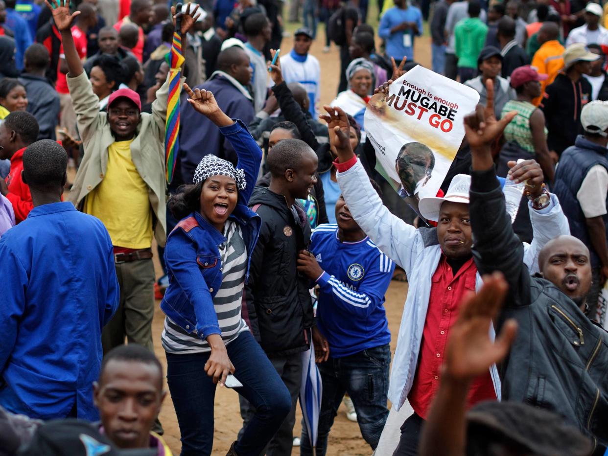 Tens of thousands of demonstrators have taken to the streets in the country’s capital Harare: AP