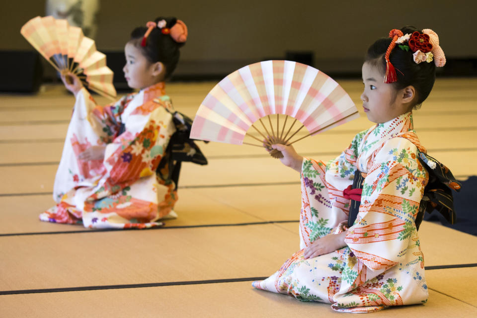 Children perform a traditional dance for U.S. first lady Melania Trump and Japanese Prime Minister Shinzo Abe's wife Akie Abe, both not pictured, during a cultural event at the Japanese style annex inside the State Guest House in Tokyo Monday, May 27, 2019. (Tomohiro Ohsumi/Pool Photo via AP)