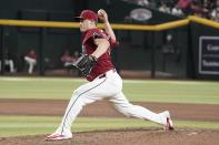 Arizona Diamondbacks pitcher Paul Sewald (38) throws during the ninth inning of a baseball game against the Cincinnati Reds, Wednesday, May 15, 2024, in Phoenix. (AP Photo/Darryl Webb)