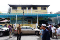 Authorities work at religious school Darul Quran Ittifaqiyah after a fire broke out in Kuala Lumpur, Malaysia September 14, 2017. REUTERS/Lai Seng Sin