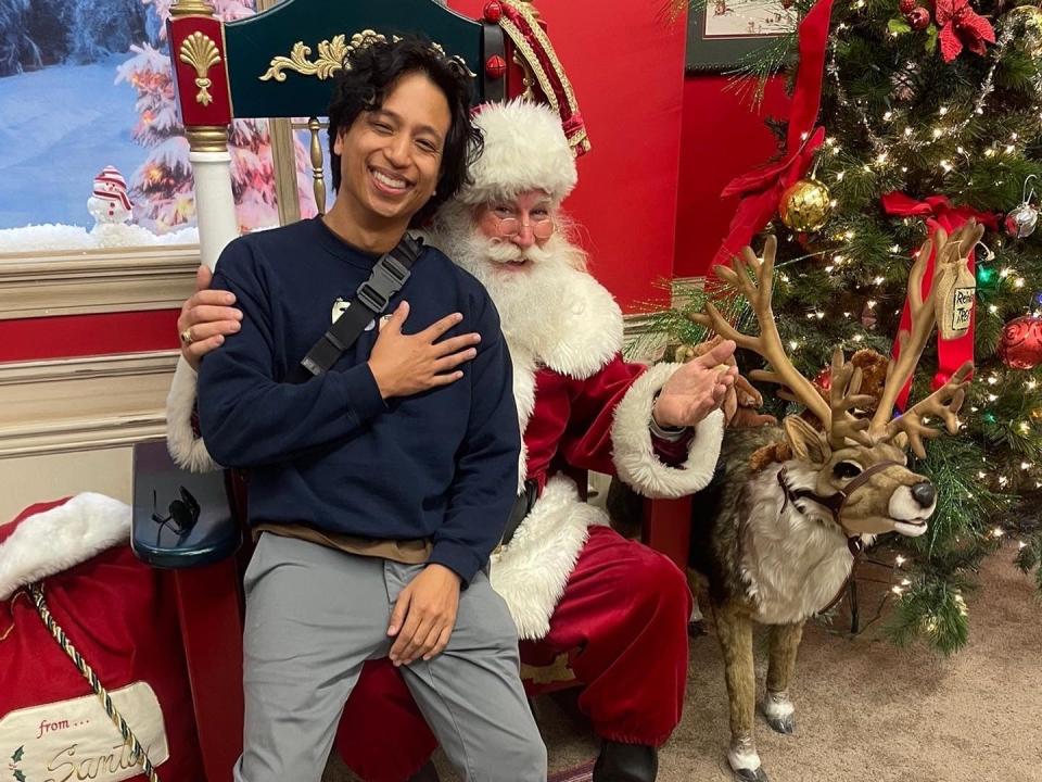 A man sitting on Santa's lap