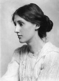 Virginia Woolf in black and white photographed from the side.