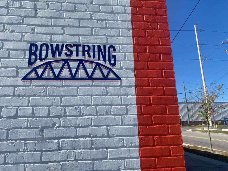 Bowstring Burgers and Brewyard sits across the street from the former Coca-Cola building.