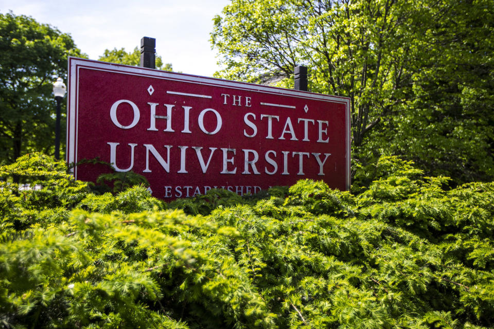This May 8, 2019 photo shows a sign for Ohio State University in Columbus, Ohio. On Friday, May 17, 2019, the school said at least 177 men were sexually abused by Ohio State team doctor Richard Strauss who died years ago, according to findings from a law firm that investigated the accusations, concluding that school leaders knew at the time. (AP Photo/Angie Wang)