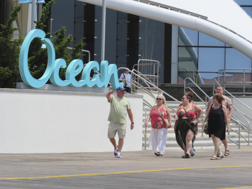 People walk past the Ocean Casino Resort in Atlantic City, N.J., on June 15, 2023. The city's two newest casinos - Hard Rock and Ocean - which both opened on June 27, 2018, have become the second and third most successful Atlantic City casinos in terms of money won from in-person gamblers. (AP Photo/Wayne Parry)