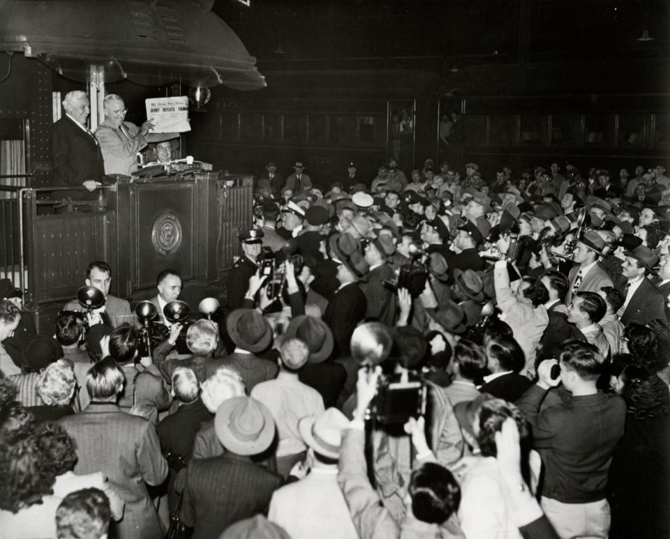 The day after the 1948 election, President Harry Truman displays the issue of a newspaper that wrongly reads &quot;Dewey Defeats Truman.&quot;