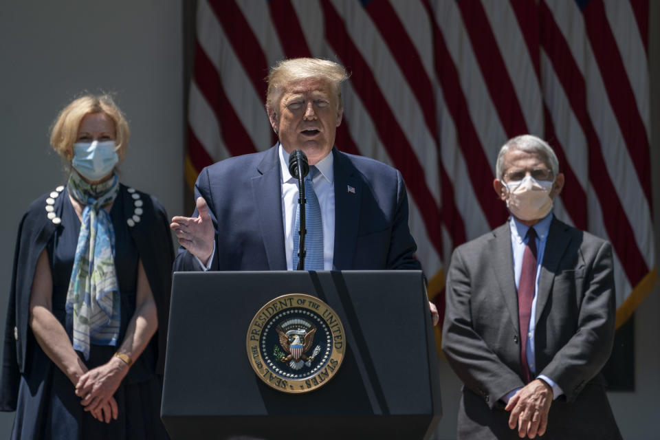 WASHINGTON, DC - MAY 15:  Flanked by White House coronavirus response coordinator Dr. Deborah Birx (L) and Dr. Anthony Fauci (R), director of the National Institute of Allergy and Infectious Diseases,  U.S. President Donald Trump delivers remarks about coronavirus vaccine development in the Rose Garden of the White House on May 15, 2020 in Washington, DC. Dubbed 