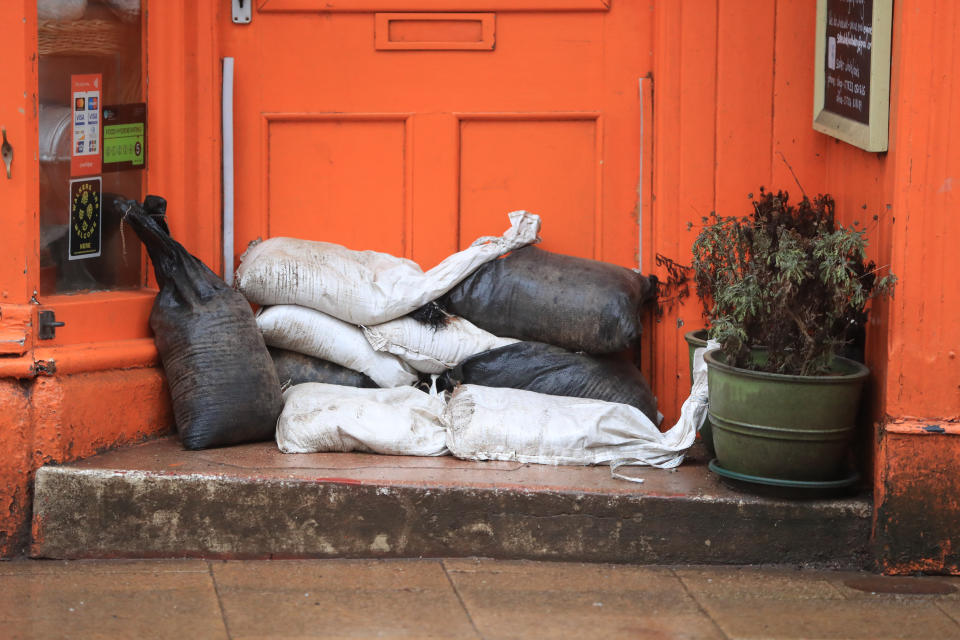 Sand bags placed against a door of a property in Hebden Bridge in the Upper Calder Valley in West Yorkshire.