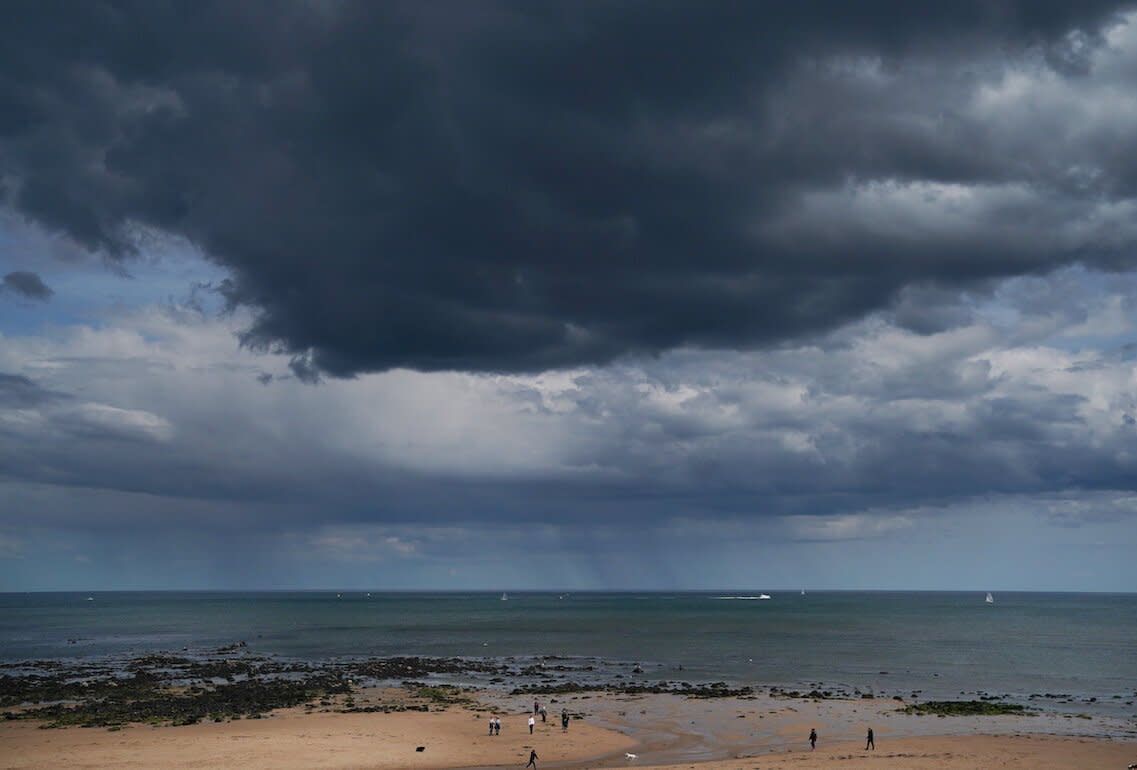 Rain clouds over Whitley Bay beach in Northumberland (Picture: PA)