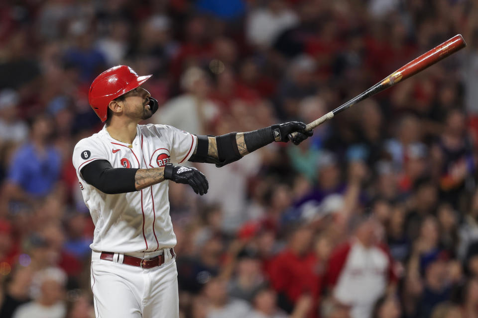 Cincinnati Reds' Nick Castellanos watches after he hits a two-run home run during the seventh inning of a baseball game against the Atlanta Braves in Cincinnati, Thursday, June 24, 2021. (AP Photo/Aaron Doster)