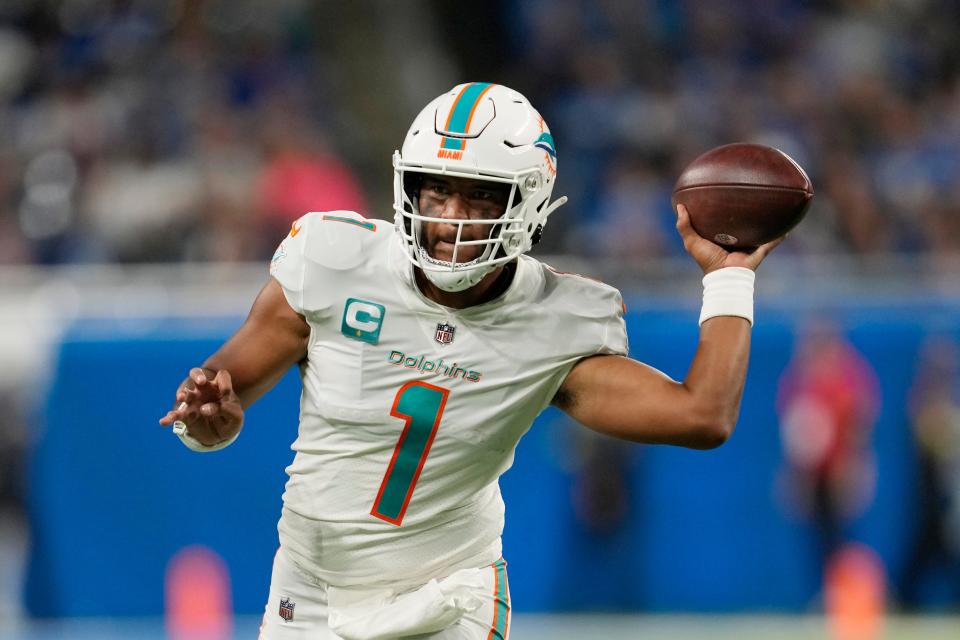 Miami Dolphins quarterback Tua Tagovailoa throws during the second half of an NFL football game against the Detroit Lions, Sunday, Oct. 30, 2022, in Detroit. (AP Photo/Paul Sancya)