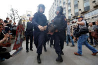 <p>Riot police detain a demonstrator during an anti-corruption protest organised by opposition leader Alexei Navalny, on Tverskaya Street in central Moscow, Russia June 12, 2017. (Maxim Shemetov/Reuters) </p>