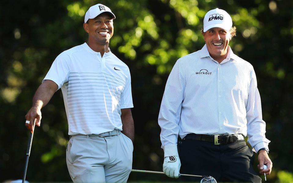 Tiger Woods and Phil Mickelson - AP