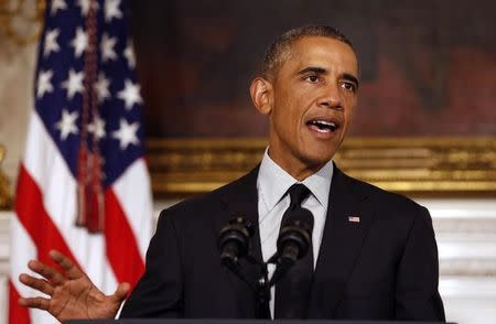 U.S. President Barack Obama makes a statement about the vote on Capitol Hill on his request to arm and train Syrian rebels in the fight against the Islamic State while in the State Dining Room at the White House in Washington, September 18, 2014. REUTERS/Larry Downing