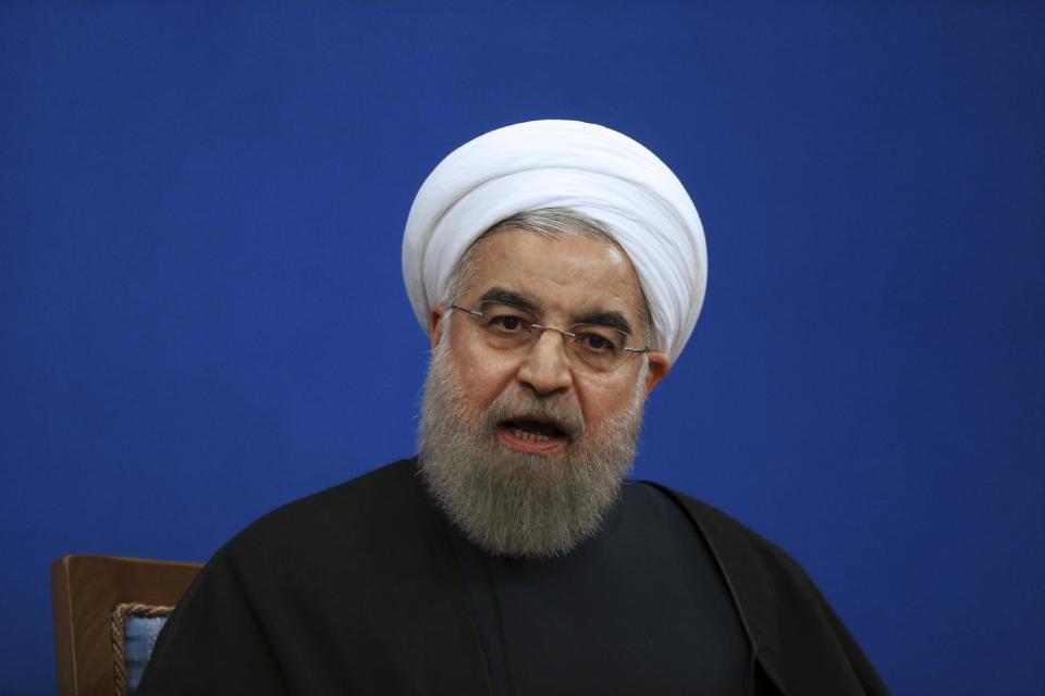 Iranian President Hassan Rouhani speaks in a press conference at the presidency compound in Tehran, Iran, Tuesday, Jan. 17, 2017. Iran's president has compared talk of renegotiating its nuclear accord to "converting a shirt back to cotton," and says U.S. President-elect Donald Trump's talk of doing so is "mainly slogans." (AP Photo/Vahid Salemi)