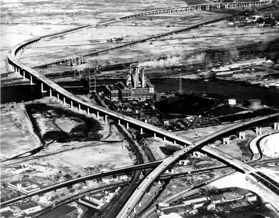 The New Jersey Turnpike crosses the Passaic River and underpasses the Pulaski Skyway in Newark, N.J., as seen in this 1952 aerial view. 