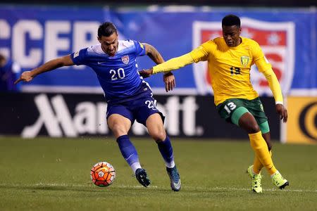 Nov 13, 2015; St.Louis, MO, USA; USA defender Geoff Cameron (20) and St. Vincent & The Grenadines forward Gavin James (13) vie for control of the ball during the first half of a FIFA World Cup Qualifying soccer match at Busch Stadium. USA won 6-1. Scott Kane-USA TODAY Sports