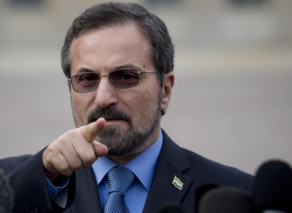 Louay Safi spokesperson for the Syrian National Coalition, Syria's main political opposition group, gestures as he speaks to journalists at the United Nations headquarters in Geneva, Switzerland, Switzerland, Saturday, Jan. 25, 2014. The Syrian government and the country's opposition held direct talks on Saturday for the first time since they entered into a war three years ago, the UN said. (AP Photo/Anja Niedringhaus)