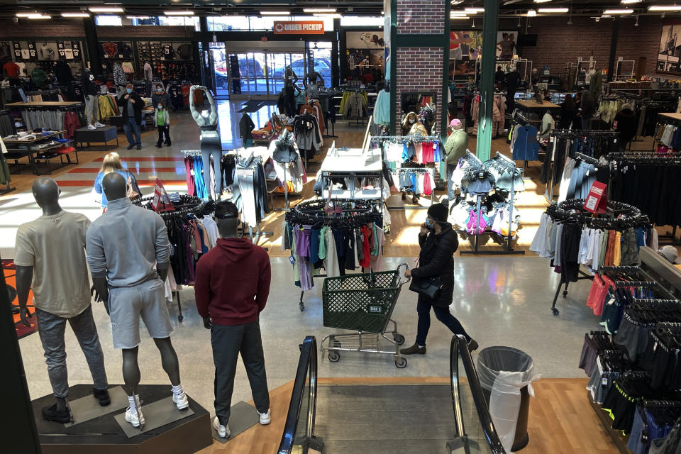 FILE - Shoppers browse at a store in Niles, Ill., on Feb. 19, 2022. A popular form of payment by installment — 'buy now, pay later' — is projected to have its biggest holiday season yet. But analysts caution more transparency is needed in the space to prevent consumers from over-extending themselves if they take on multiple loans. (AP Photo/Nam Y. Huh, File)