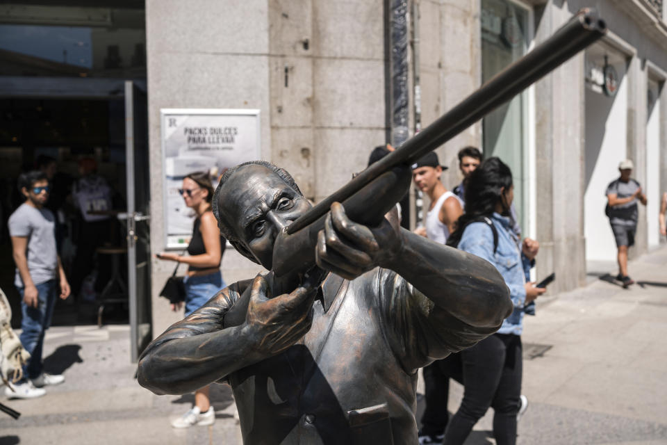 A statue of Spain's former King Juan Carlos with a hunting rifle, by Chilean sculptor Nicolas Miranda, stands in the central Puerta del Sol in Madrid, on April 25, 2023. The statue was removed by authorities as the artist didn't have permission to mount it there. A playboy past that was once brushed under the carpet, a popular son whose telegenic family threatens to eclipse his own star, and endless leaks about his private life: Spain’s Juan Carlos I can empathize with the lot of Britain’s Charles III. The former Spanish head of state abdicated in disgrace in 2014, and serves as a warning for any European royal who wants their achievements on the throne, rather than torrid gossip, to be their lasting legacy. (Diego Radames/Europa Press via AP)