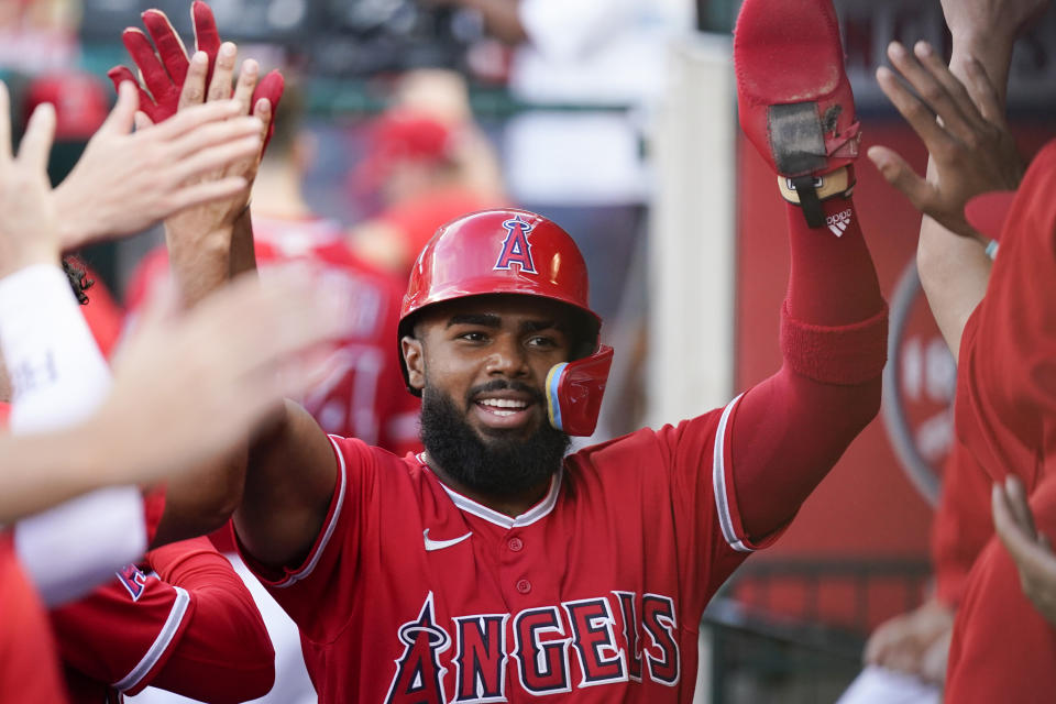 Los Angeles Angels' Luis Rengifo (2) celebrates after scoring off of a single hit by Shohei Ohtani during the first inning of a baseball game against the San Francisco Giants in Anaheim, Calif., Tuesday, Aug. 8, 2023. (AP Photo/Ashley Landis)