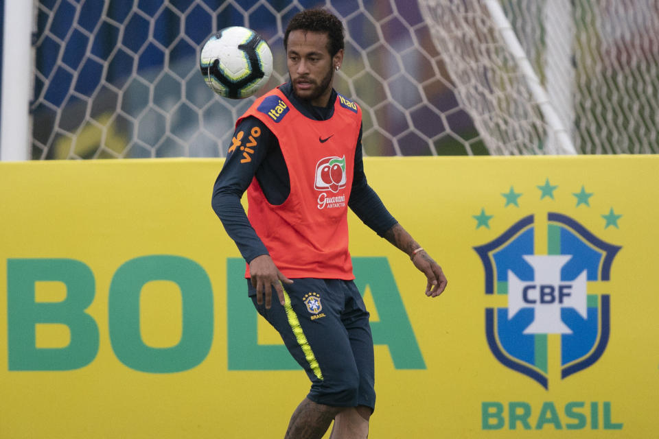 Brazil's soccer player Neymar controls the ball during a practice session at the Granja Comary training center ahead the Copa America tournament in Teresopolis, Brazil, Sunday, June 2, 2019. A Brazilian police document says an unidentified woman has accused soccer star Neymar of raping her in Paris last month. After the revelation, the player used Instagram to publish a 7-minute video that includes WhatsApp messages he says he exchanged with the accuser in a friendly way days later. (AP Photo/Leo Correa)