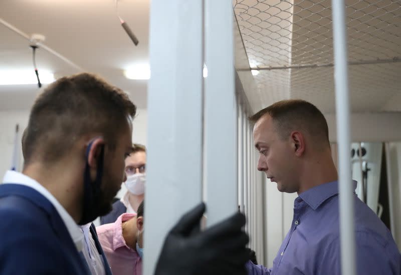 Ivan Safronov, a former journalist who works as an aide to the head of Russia's space agency Roscosmos, detained on suspicion of treason attends a court hearing in Moscow