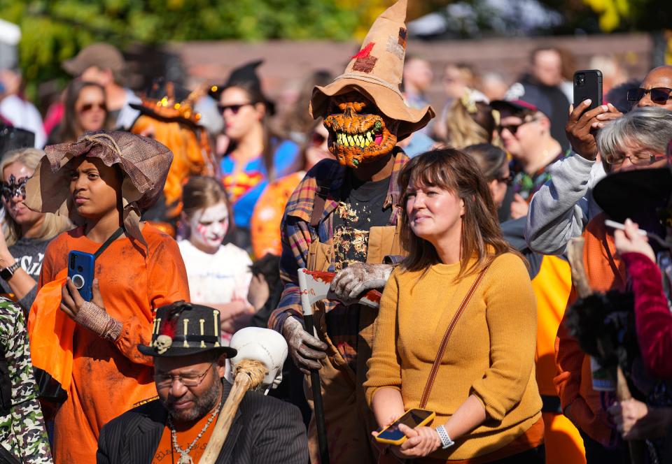 Costumed festival-goers walk the 76th annual Irvington Halloween Street Fair on Saturday, October 29, 2022, on the east side of Indianapolis. The festival offered a week of events culminating in the massive Saturday street fair. 