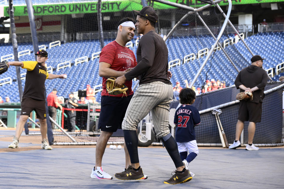 San Diego Padres' Juan Soto, right, shakes hands with Washington Nationals starting pitcher Anibal Sanchez, left, before a baseball game, Friday, Aug. 12, 2022, in Washington. (AP Photo/Nick Wass)