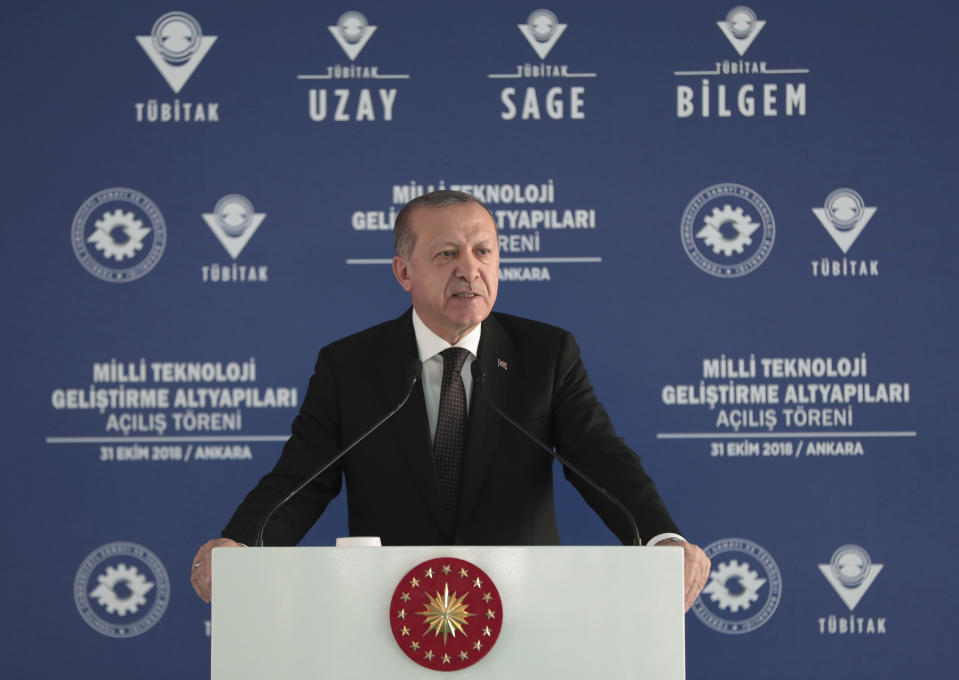 Turkey's President Recep Tayyip Erdogan addresses a defence technology development meeting, in Ankara, Turkey, Wednesday, Oct. 31, 2018. Turkey's state-run news agency says the Turkish military has shelled positions held by U.S.-backed Kurdish fighters across the border east of the Euphrates River in Syria, killing four Kurdish fighters and wounding six others. The attack came a day after Erdogan said Turkey has finalized plans for a "comprehensive and effective" operation to drive out Kurdish militia from the region.(Presidential Press Service via AP, Pool)