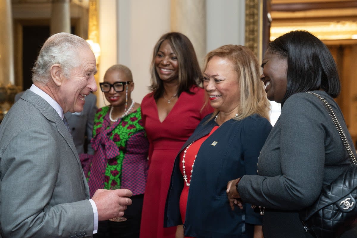The King greets Black Powerlist guests at a Buckingham Palace reception (PA Wire)
