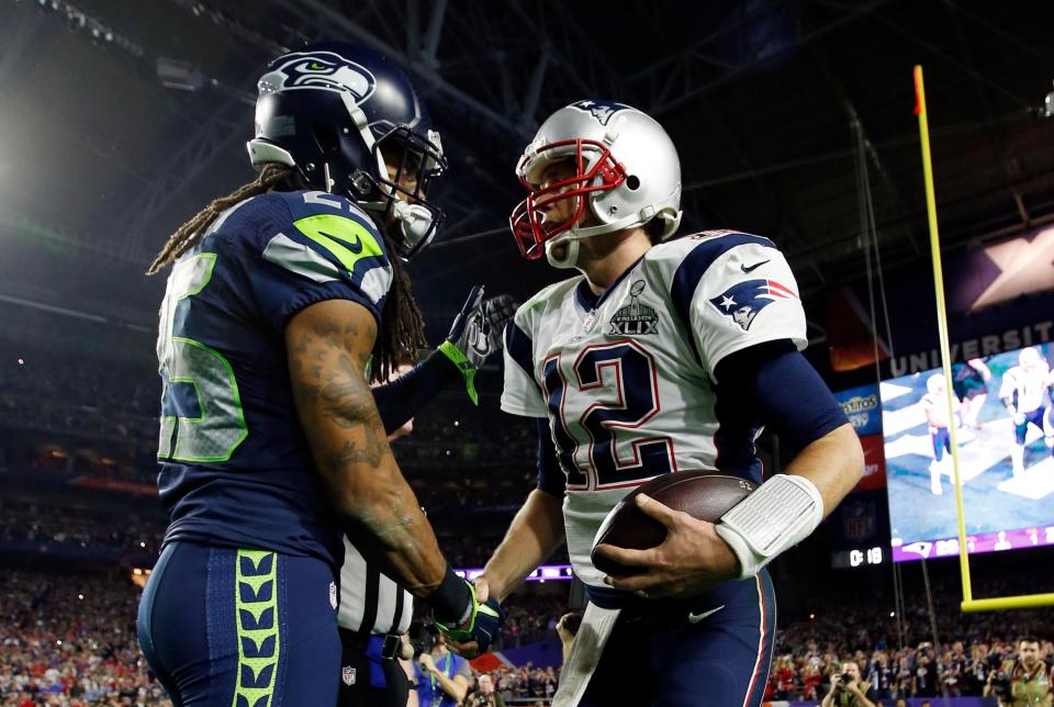 Seahawks CB Richard Sherman congratulates Patriots QB Tom Brady (12) after New England's Super Bowl 49 triumph.