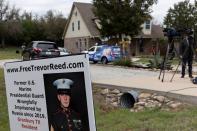 FILE PHOTO: News media crews assemble outside the family home of former U.S. Marine Trevor Reed