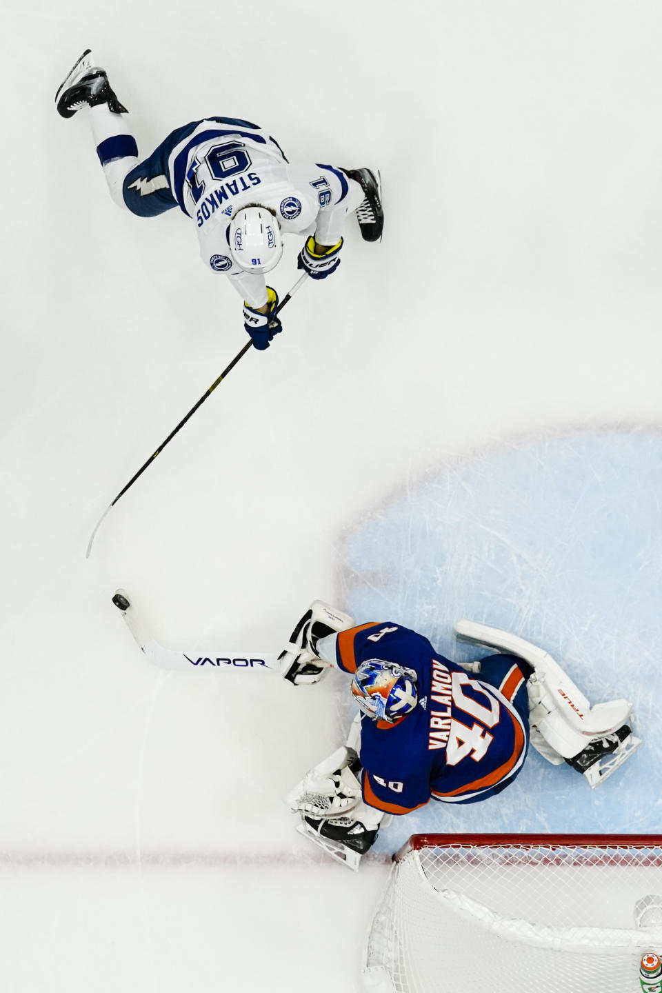 New York Islanders goaltender Semyon Varlamov (40) stops a shot on goal by Tampa Bay Lightning's Steven Stamkos (91) during the first period of Game 6 of an NHL hockey semifinals Wednesday, June 23, 2021, in Uniondale, N.Y. The Islanders won 3-2. (AP Photo/Frank Franklin II)