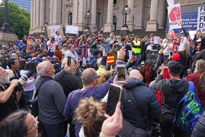 Protesters gather outside Parliament House in Melbourne.