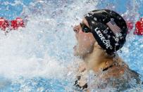 Katie Ledecky of the U.S. celebrates after setting a new world record and winning the women's 800m freestyle final at the Aquatics World Championships in Kazan, Russia, August 8, 2015. REUTERS/Michael Dalder