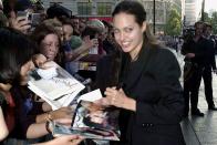<p>Happily signing autographs at the <em>Tomb Raider</em> premiere in July 2001.</p>