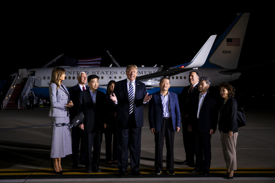 <p>President Donald Trump, center, speaks to members of the media as U.S. First Lady Melania Trump, left, U.S. Vice President Mike Pence, second left, Second Lady Karen Pence, fourth left, and Mike Pompeo, secretary of state, third right, stand with American citizens, released from detention in North Korea, Kim Sang-dok, also known as Tony Kim, third left, Kim Dong-chul, fourth right, and Kim Hak-song, second right, at Joint Base Andrews, Maryland, U.S., on Thursday, May 10, 2018. (Photo: Al Drago/Bloomberg via Getty Images) </p>