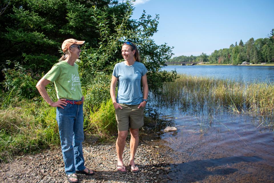 Lawson Gerdes and Amy Freeman stand near the Kawishiwi River near Ely, Minn., in September 2023. Both Gerdes and Freeman worry about climate change and environmental issues encroaching on the Boundary Waters Canoe Area Wilderness.