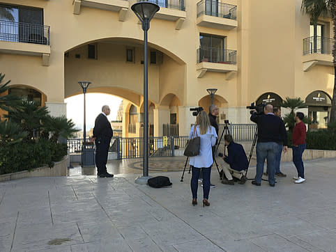 Media gather at the Portomaso port where a yacht, which is believed to have been intercepted by Maltese police to arrest prominent businessman Yorgen Fenech in connection with an investigation into the murder of journalist Daphne Caruana Galizia, according