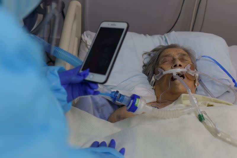 A woman says goodbye to her mother in a COVID-19 ICU in Houston