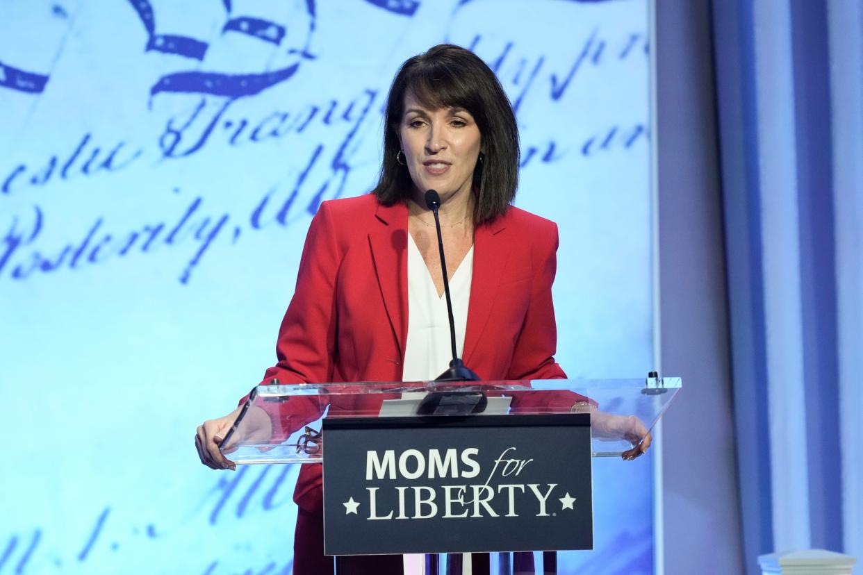 Moms for Liberty co-founders Tina Descovich, left, speaks at the Moms for Liberty meeting in Philadelphia, June 30, 2023.