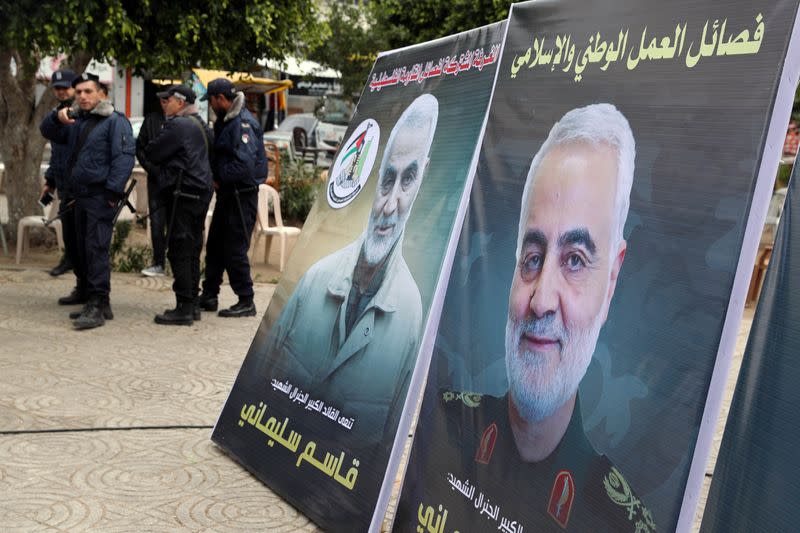 Pictures of Iranian Major-General Qassem Soleimani are seen during a protest against the killing of Soleimani, in Gaza