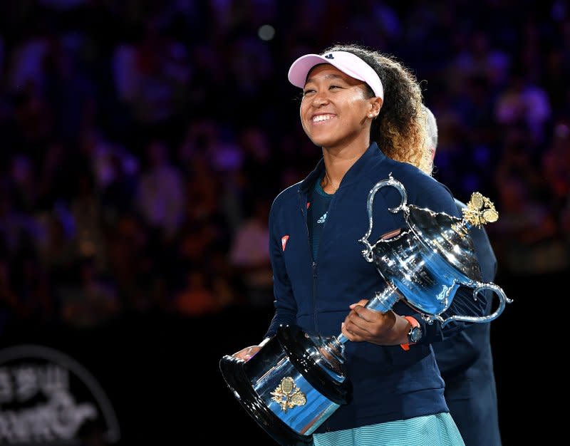 Naomi Osaka of Japan reacts during the presentation of the winner's trophy after defeating Petra Kvitova of the Czech Republic in the women's singles final January 26, 2019, at the Australian Open Grand Slam tennis tournament in Melbourne. File Photo by Julian Smith/EPA-EFE