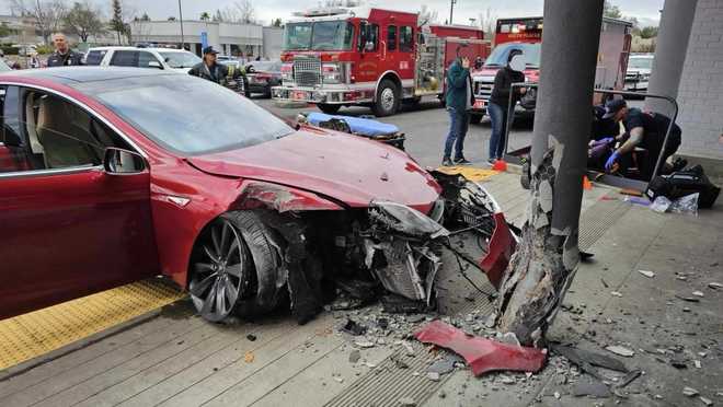A Tesla crashed into a Girl Scout cookie stand outside a Walmart store in California.