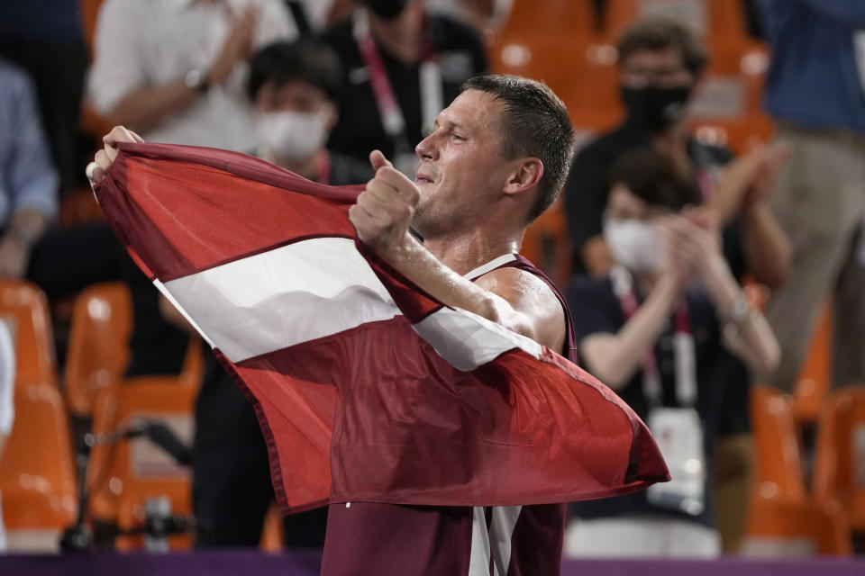 Latvia's Agnis Cavars (4) celebrates after defeating Russian Olympic Committee to win the men's 3-on-3 basketball gold medal at the 2020 Summer Olympics, Wednesday, July 28, 2021, in Tokyo, Japan. (AP Photo/Jeff Roberson)