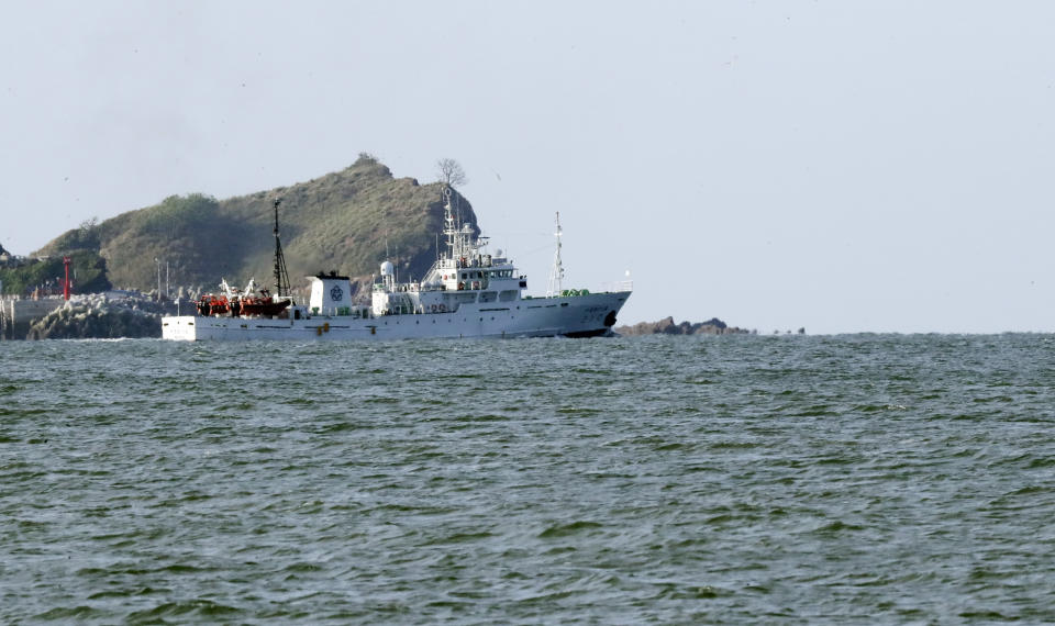 South Korea's government ship for a fishery guidance is seen near Yeonpyeong island, South Korea, Saturday, Sept. 26, 2020. South Korea said Saturday it will request North Korea to further investigate the killing of a South Korean government official who was shot by North Korean troops after being found adrift near the rivals' disputed sea boundary while apparently trying to defect. (Choi Jin-suk/Newsis via AP)