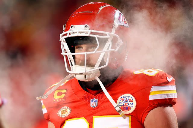 <p>Jamie Squire/Getty Images</p> Travis Kelce warms up before the AFC Wild Card Playoffs against the Miami Dolphins at GEHA Field at Arrowhead Stadium on January 13, 2024