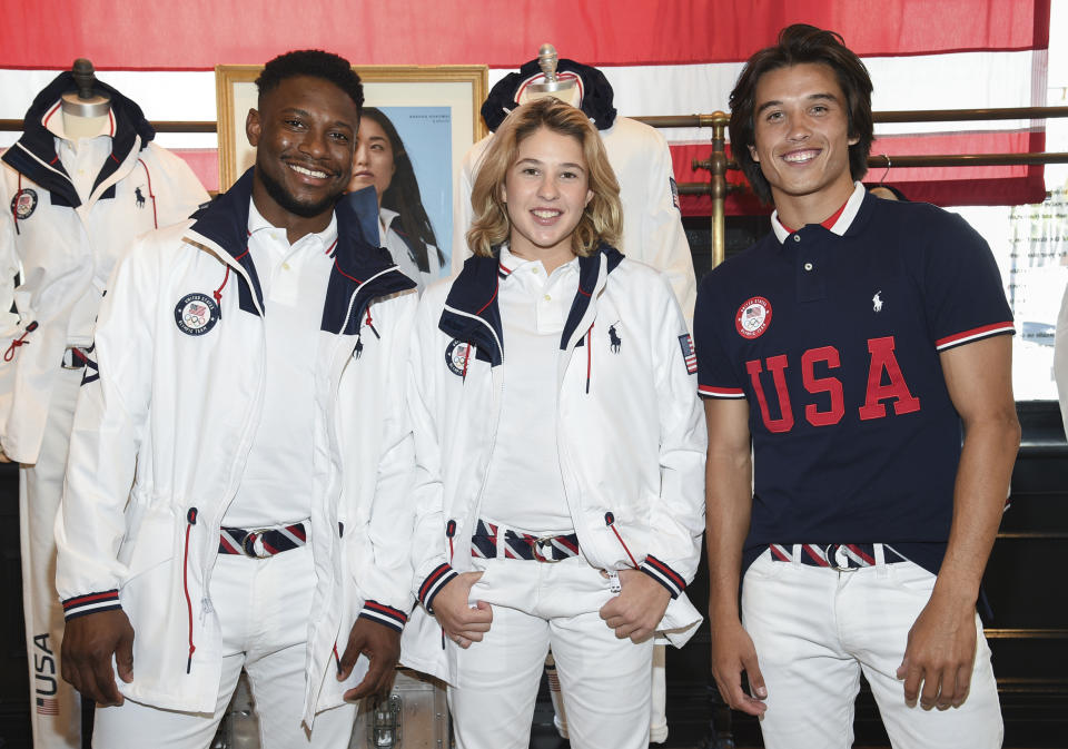 Athletes Daryl Homer (Fencing), left, Jordyn Barratt (Skateboard) and Heimana Reynolds (Skateboard) participate in the Team USA Tokyo Olympic closing ceremony uniform unveiling at the Ralph Lauren SoHo Store on April 13, 2021, in New York. Ralph Lauren is an official outfitter of the 2021 U.S. Olympic Team. (Photo by Evan Agostini/Invision/AP)